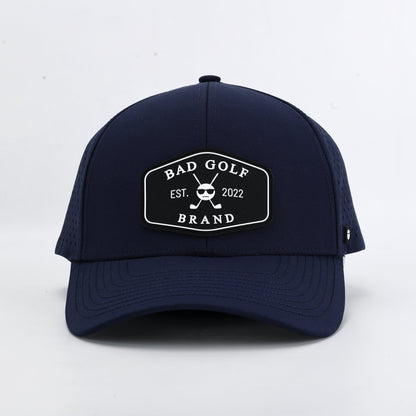 Navy blue cap with a brand logo on a white background. The Summit collection by Bad Golf Brand
