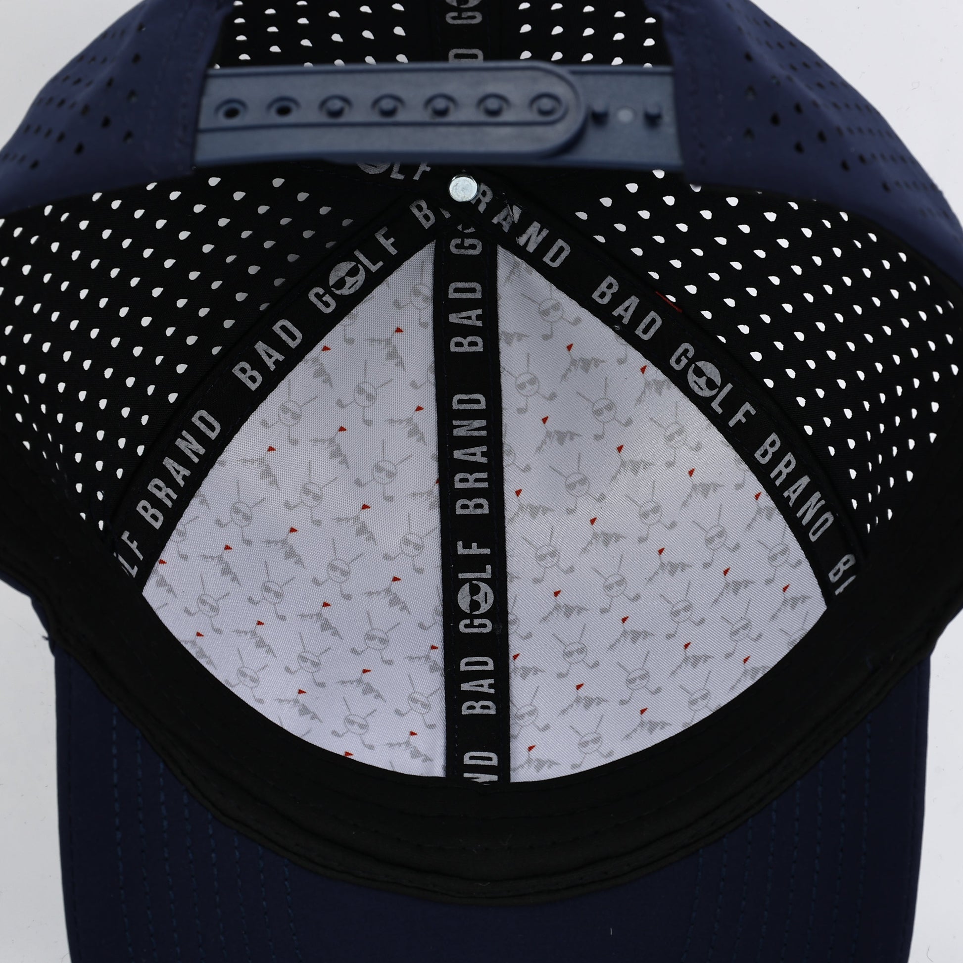 Navy blue cap with studded design and  branding on a white background. The Summit Collection by Bad Golf Brand