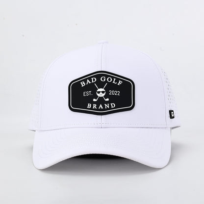 White cap with a black logo on a light gray background. The summit collection by Bad Golf Brand.
