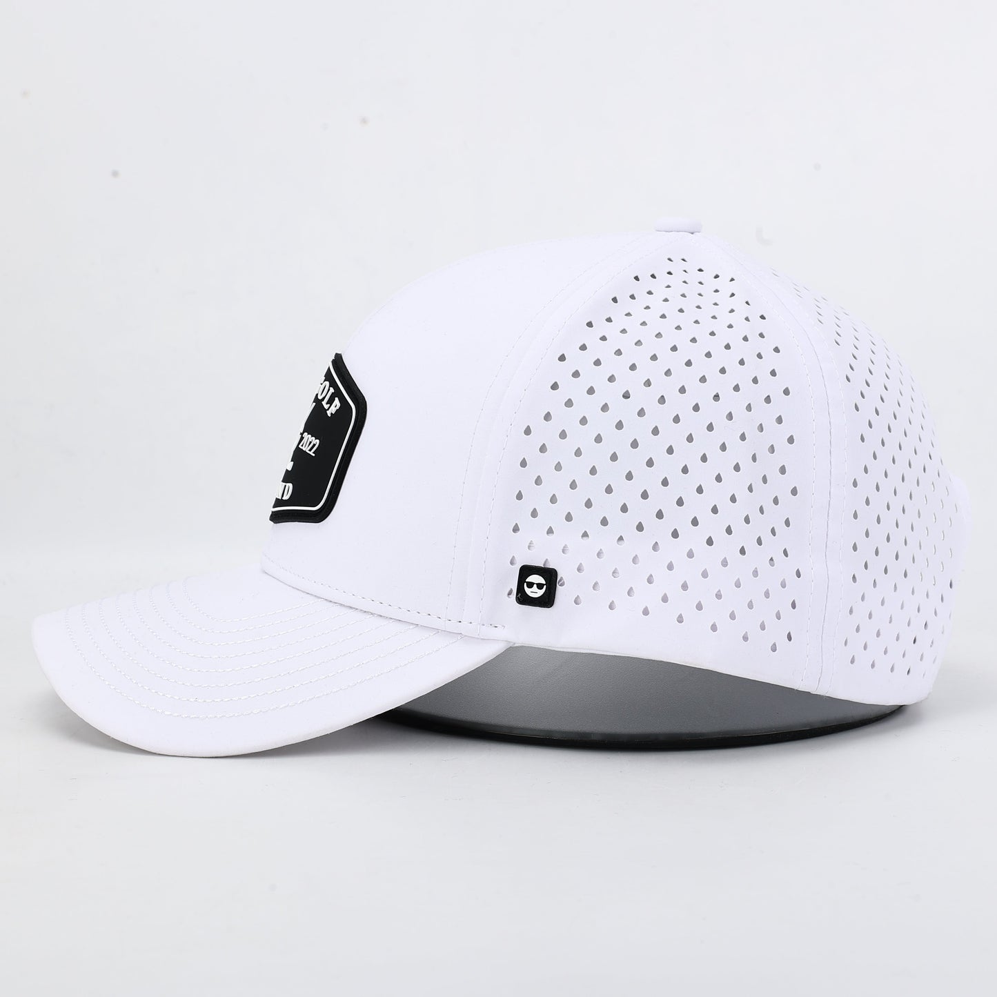 White baseball cap with black silicone Bad Golf Brand logo. The summit collection by Bad Golf Brand.