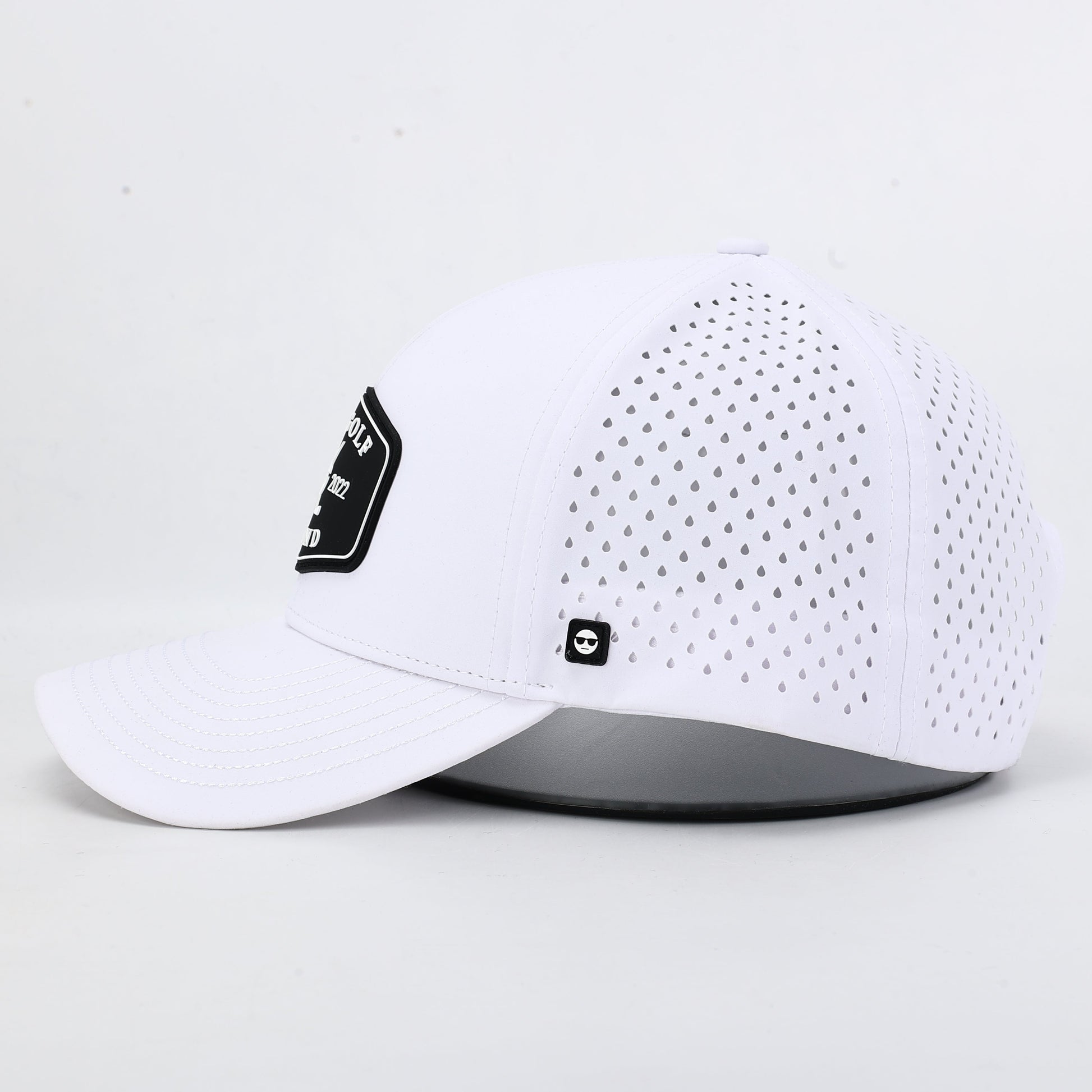 White baseball cap with black silicone Bad Golf Brand logo. The summit collection by Bad Golf Brand.